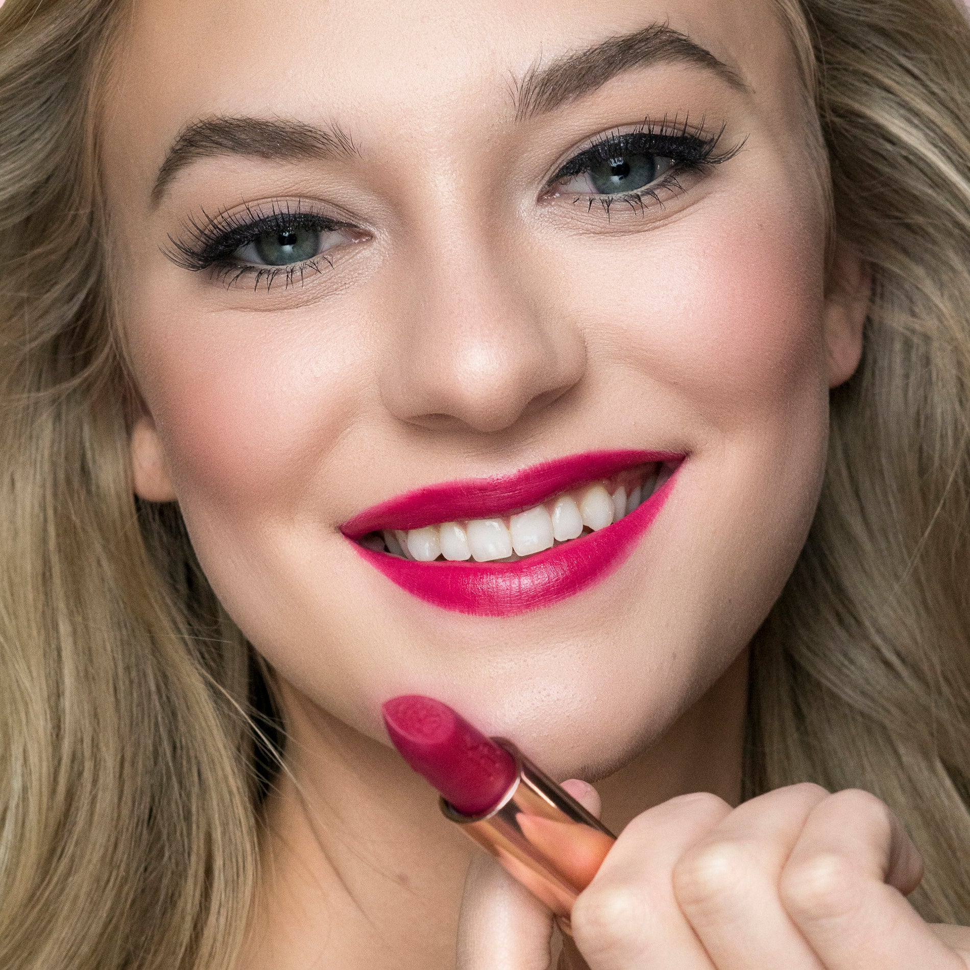 10 Magenta Moon - Natural Lipstick on a smiling model