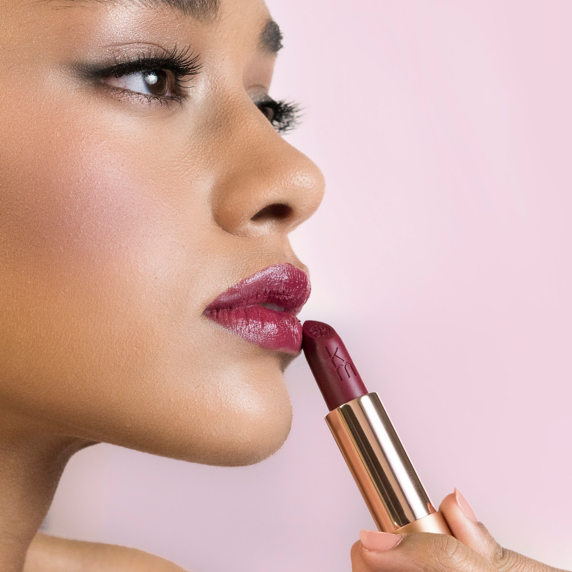 Model applying 11 Scarlet Blaze - Natural Lipstick 