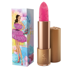 Pink lipstick in gold cannister, box featuring a lady in a pink dress holding a handbag 