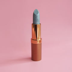 Blue lipstick on a pink background