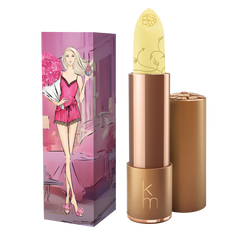 A colorless lip balm stick with the Karen Murrell brand logo, displayed against a backdrop with floral elements and a 'VIVA Finalist 2025 Beauty Awards' seal.
